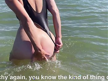 On the public beach, my husband has to keep the chastity cage